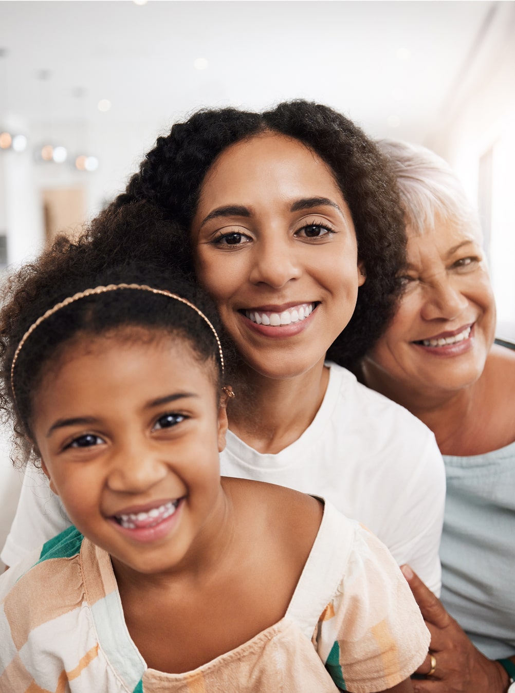 mother and grandmother with child together with smile