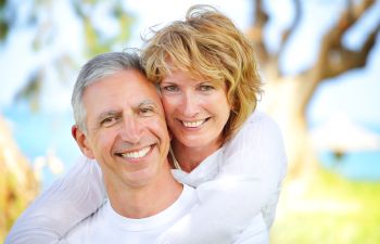 Senior couple with perfect smiles.