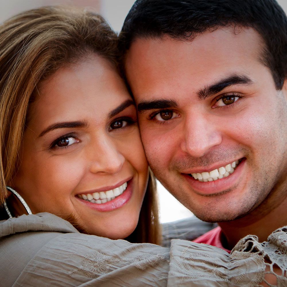 a young couple with beautiful teeth